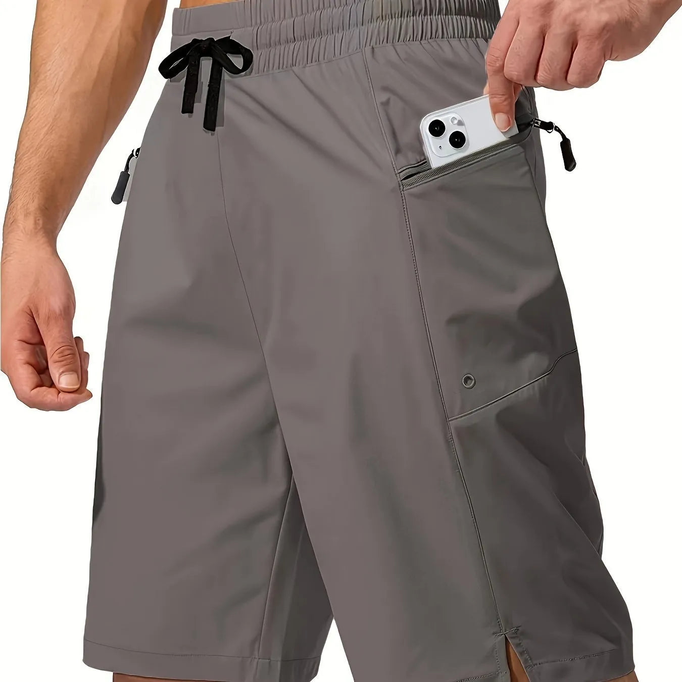 Man wearing solid colour straight-leg beach shorts in quick-dry polyester fabric.