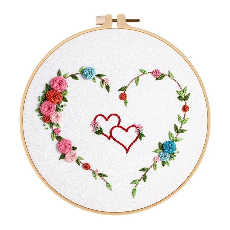 DIY Valentine's heart embroidery kit with cotton cloth and 20cm bamboo ring on a table.