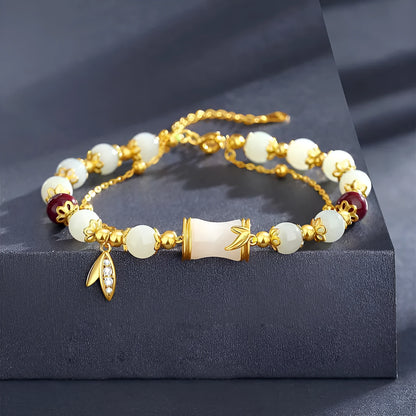 Retro bamboo design bracelet with floral shape and ruyi element in glass and coloured glaze