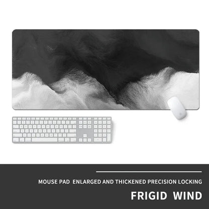 Oversized rectangular mouse pad with a printed design on a desk, next to a keyboard and mouse.