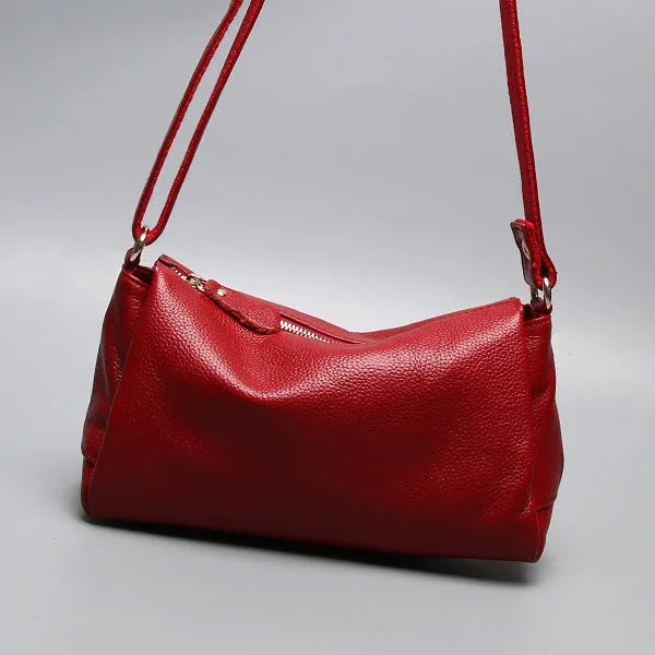 Soft genuine cowhide leather women's crossbody bag in horizontal square shape on a single strap.