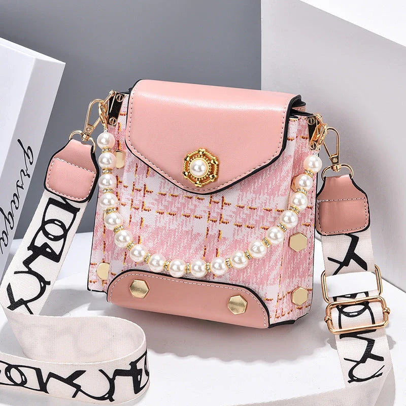 Stylish crossbody bag for women with delicate pearl pendant and adjustable strap for versatile carrying options