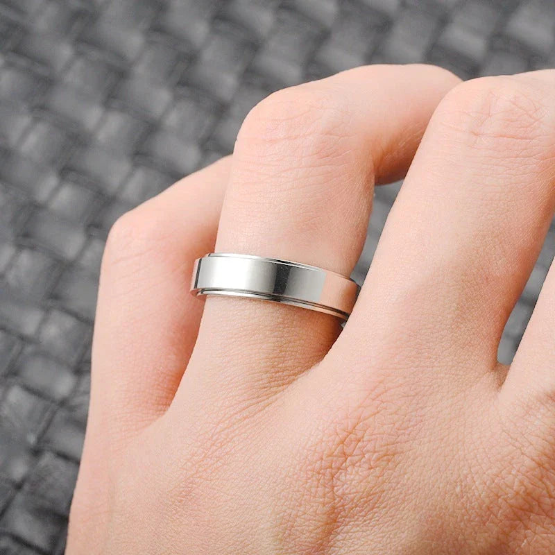 Rotatable stainless steel spinner ring with moon and star designs for anxiety relief and style