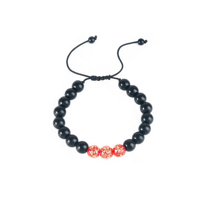Adjustable luminous beaded bracelet with geometric glass beads on a stretchy elastic band in sapphire blue