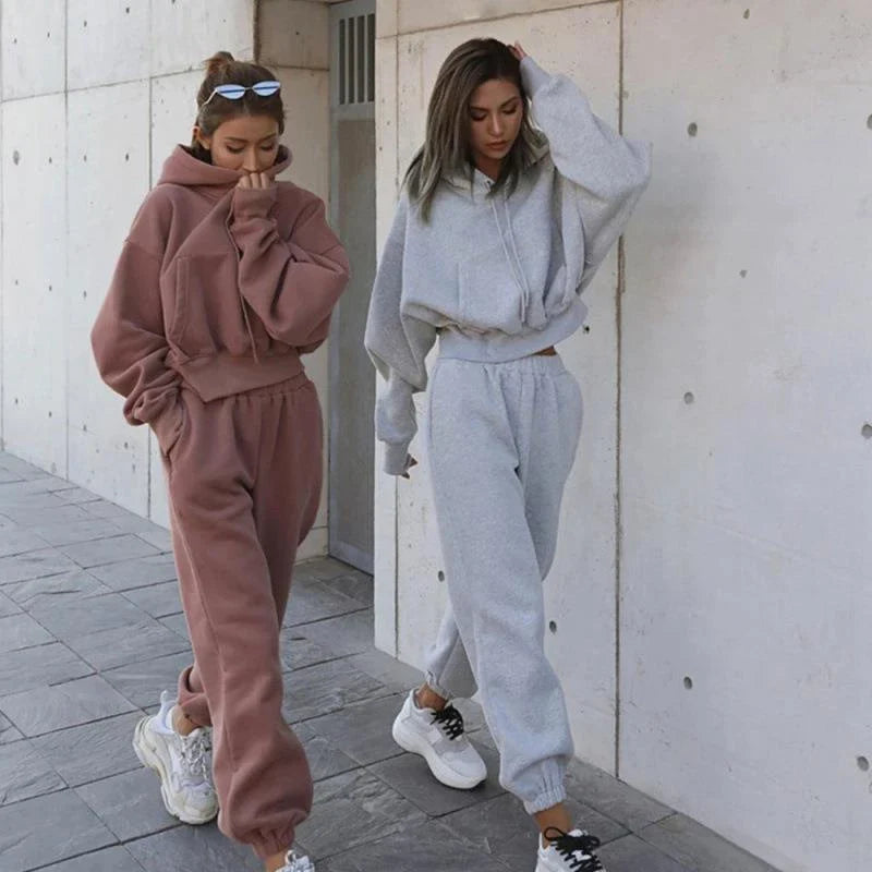 Women's polyester hoodie jacket and sports pants set in various colors for casual and athletic wear