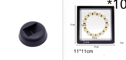 Black 11x11cm suspended 3D floating display frame holding a coin, with square base for stable collectible showcase