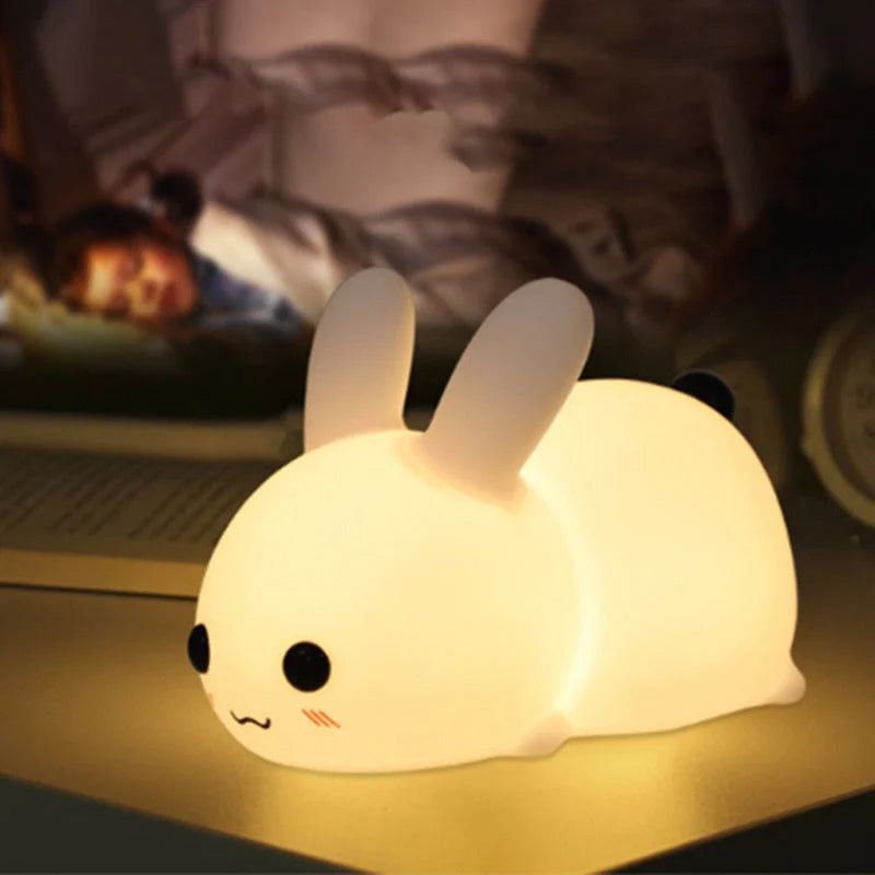 Rabbit-shaped silicone nightlight with warm amber and cool white dual colour illumination, perfect for bedside or home decor