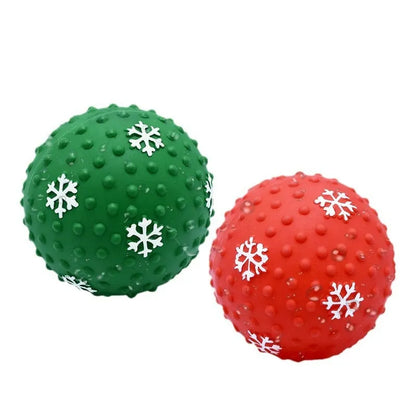Red and green Christmas snowflake print dog chew ball with air vents, approx 7cm diameter.