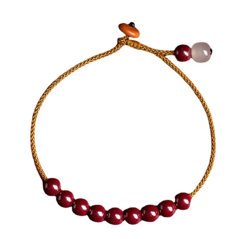 Hand-woven cinnabar bracelet with Hetian jade accents and simple geometric design