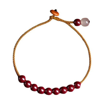 Hand-woven cinnabar bracelet with Hetian jade accents and simple geometric design
