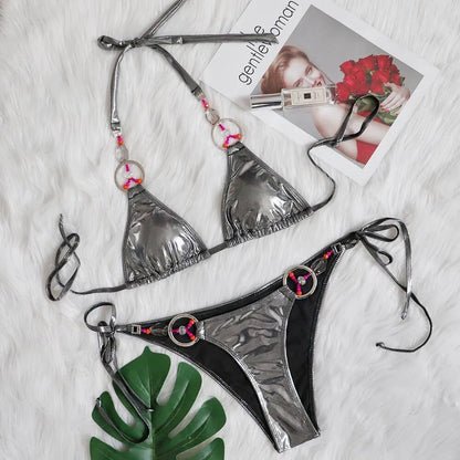 Silver women's bikini swimsuit with split briefs design on mannequin