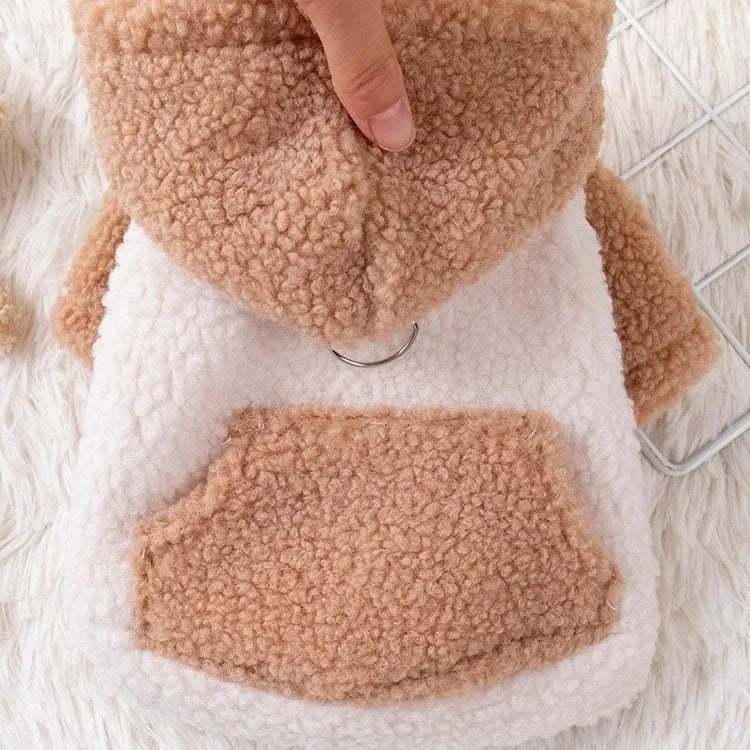 Brown hooded cotton-padded dog coat on a small dog, showing the thickened material and attached hood.