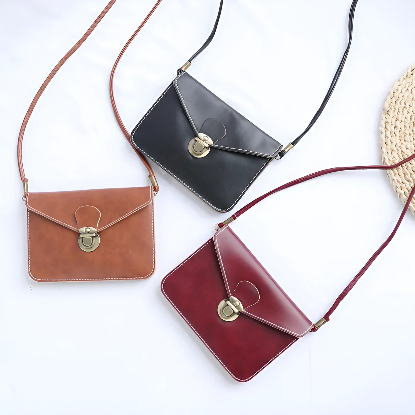 Retro shoulder messenger bag in cross square shape with flap and lock closure, showing internal mobile phone compartment