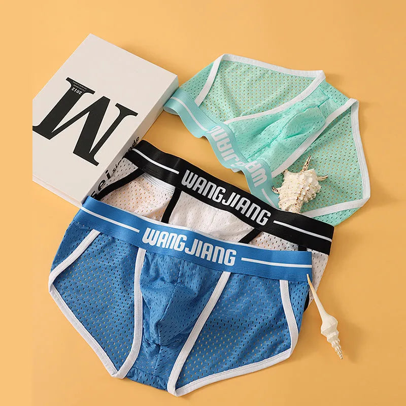 Men's solid colour Ice Silk triangle briefs on a white background, showing the mesh fabric texture.