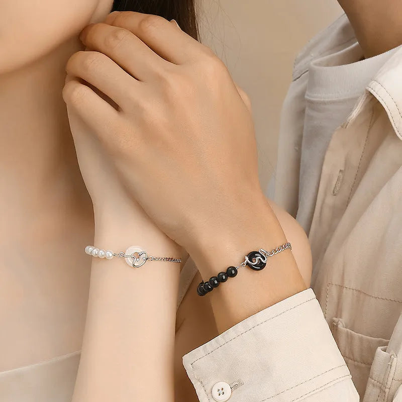 A New Chinese style 925 sterling silver couple's bracelet with snake zodiac detailing and a safe buckle clasp.