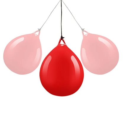 Red water-filled PVC boxing reaction ball with hook rope for hanging speed training drills.