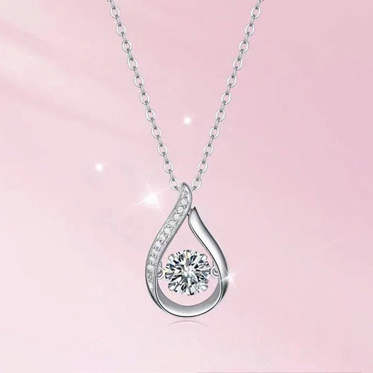 Elegant drop-shaped necklace in luxurious white gold, featuring a captivating water droplet design