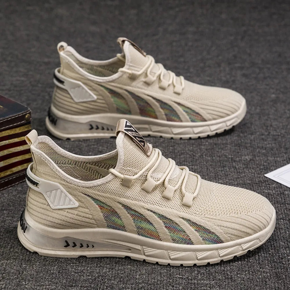 Low-top casual sneakers with striped mesh upper and flat plastic sole in grey colour.