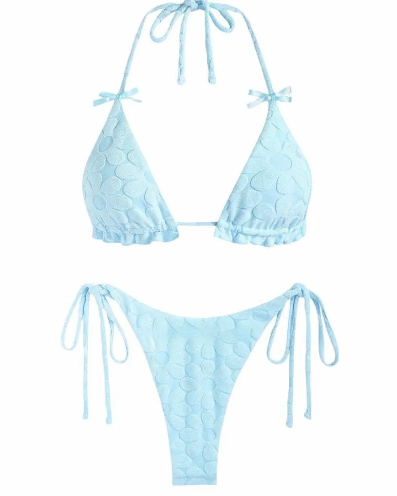 Women's light blue strappy backless bikini swimsuit on a mannequin