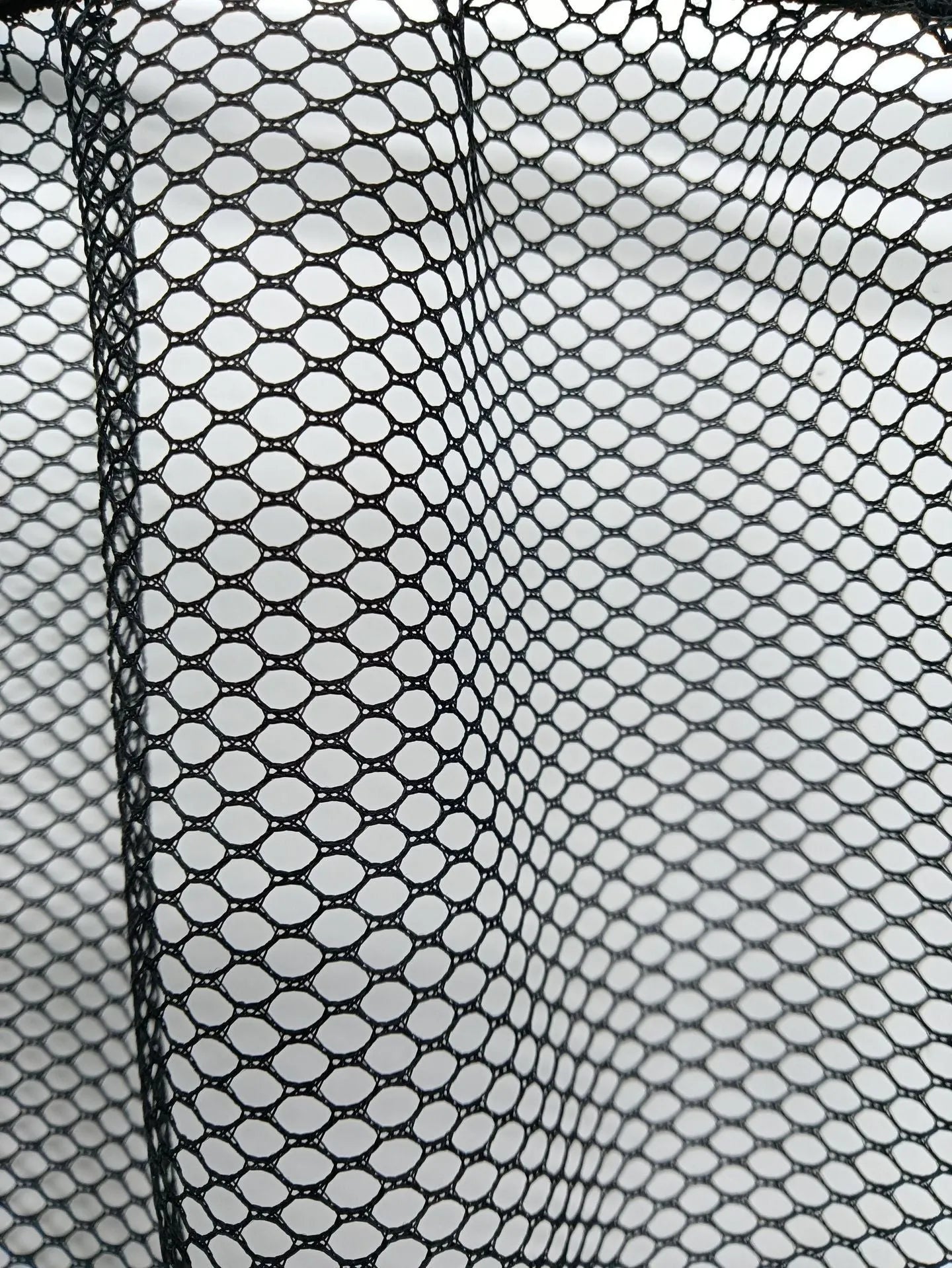 Elastic car boot storage net in polyester material for organising loose items in luggage compartment
