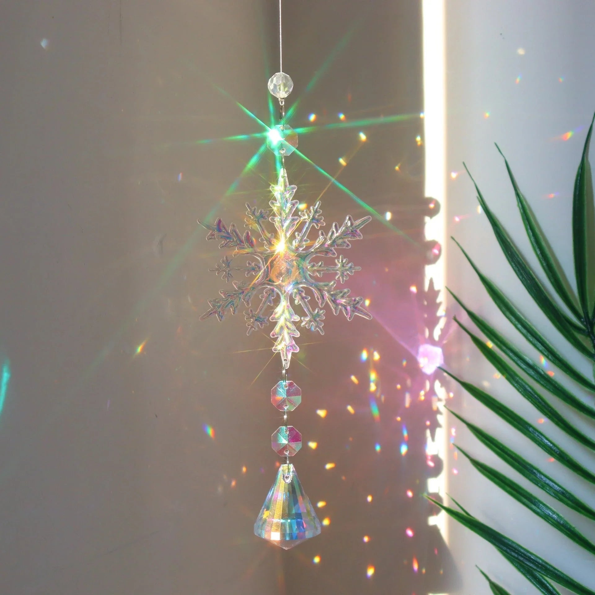 Snowflake Crystal Sun Catcher with intricate design and iridescent AB color finish, creates a mesmerizing kaleidoscope of colors