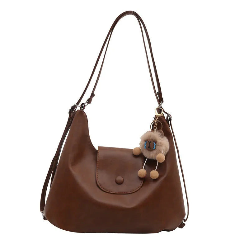 Women's leather shoulder bag with single strap and horizontal square shape in black colour