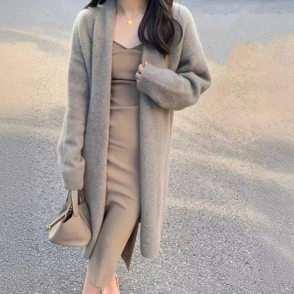 Women's knitted cardigan with V-neck and long sleeves in khaki colour, showing mid-length design