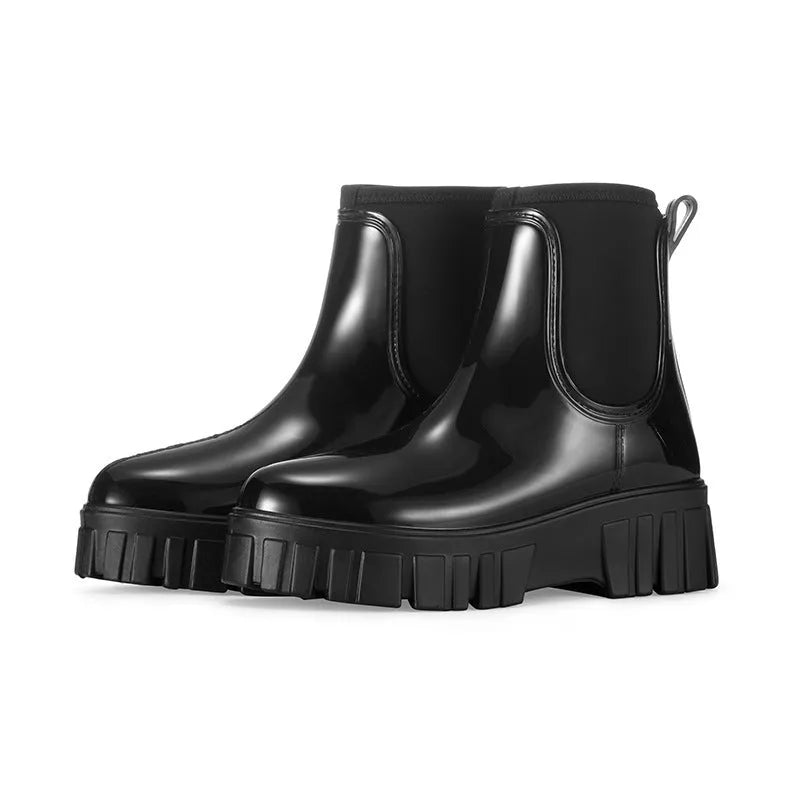 Women's creamy-white low tube PVC rain boots with a flat heel and thickening sole, shown from the side.