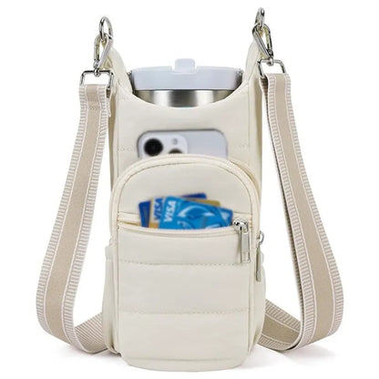 Black cloth water bottle carrier bag mounted on bicycle handlebars