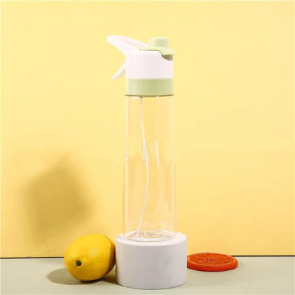 White spray water bottle with black leakproof lid and handle strap on a table