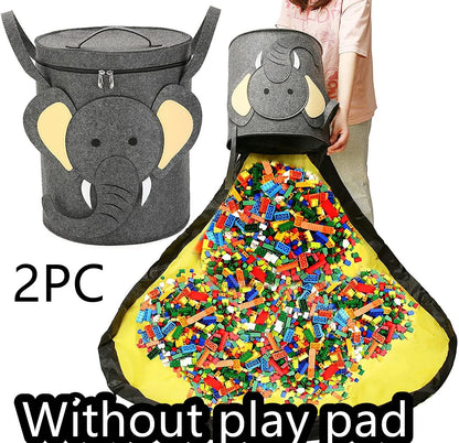 Green felt storage cube with pull rope, unfolded flat as a square play mat next to toys.