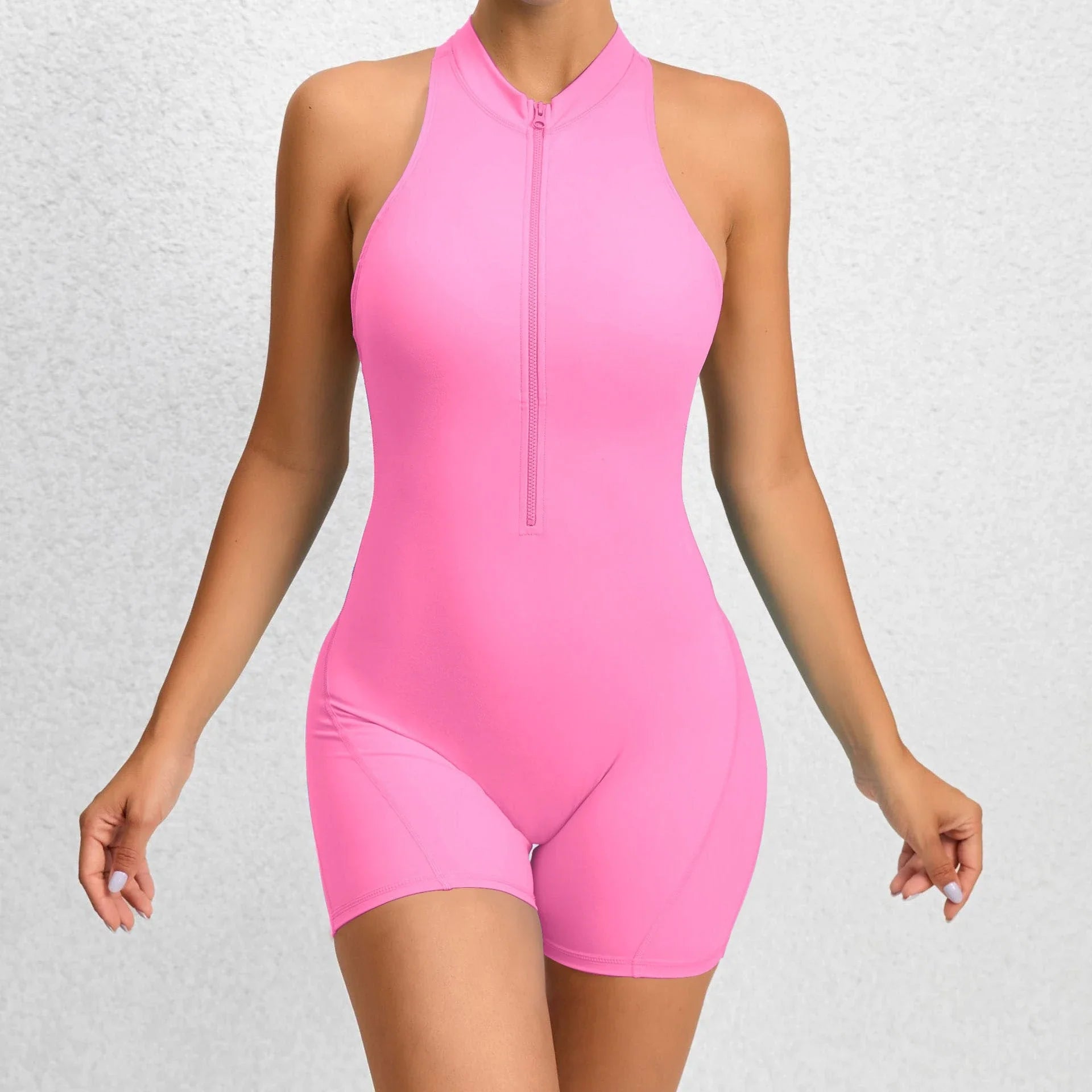 Stylish and functional zippered yoga jumpsuit with stretchy and breathable fabric, available in a variety of vibrant colors