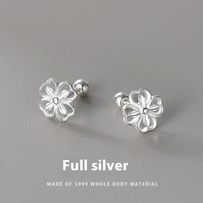 Elegant sterling silver stud earrings with delicate floral accents, suitable for both men and women