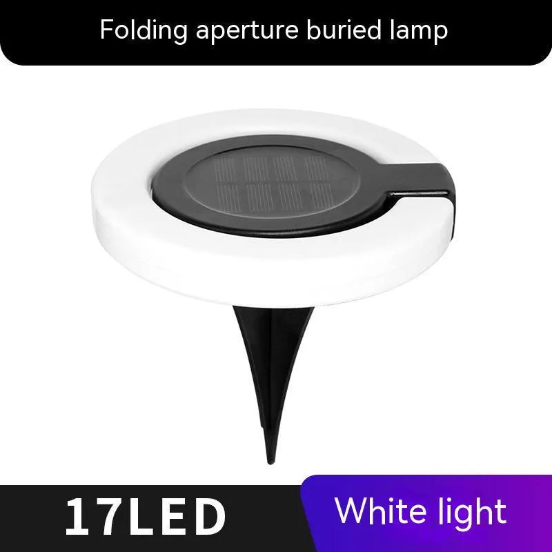Solar-powered waterproof underground garden light showing its low-profile design and solar panel.