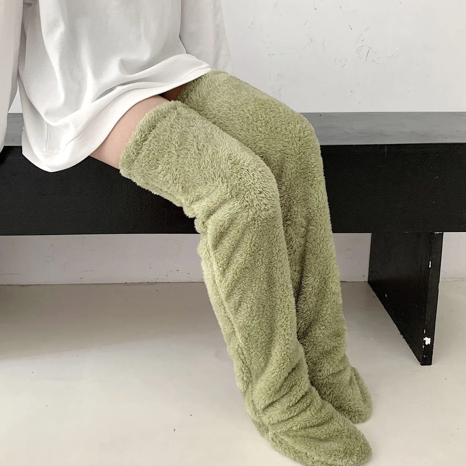 Cozy over-the-knee fuzzy socks in a variety of colors for winter warmth and comfort