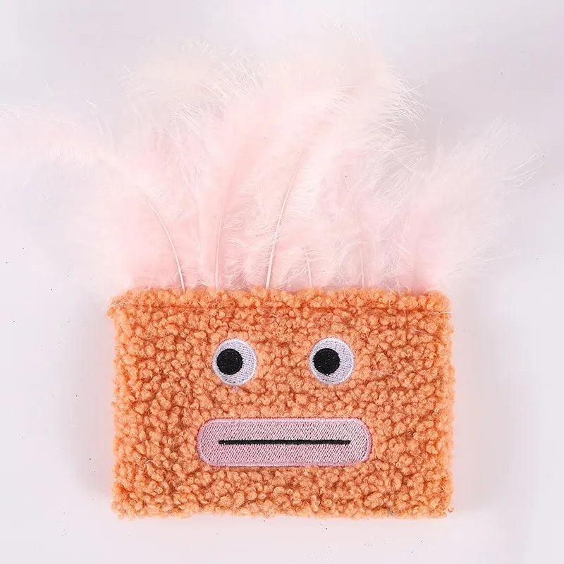 Colourful plush cat toy shaped like an explosion head with a large open mouth, shown in blue.