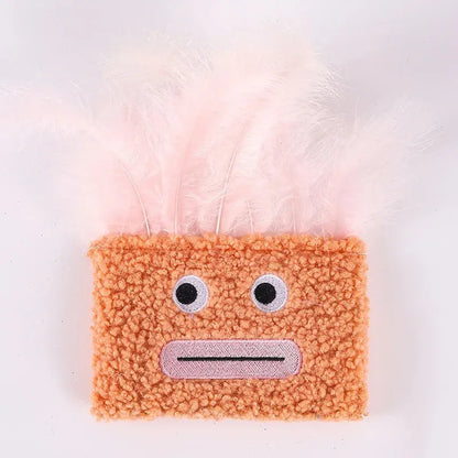 Colourful plush cat toy shaped like an explosion head with a large open mouth, shown in blue.