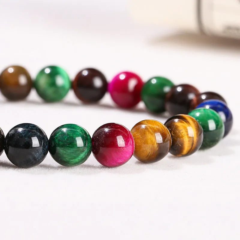 Colourful tiger-eye gemstone bracelet with round beads in 6mm, 8mm, 10mm, and 12mm sizes on mixed string
