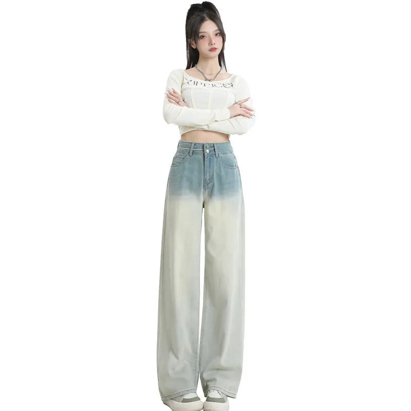 Women's gradient blue denim straight-leg trousers with 100% cotton fabric, showing colour transition and straight-leg silhouette