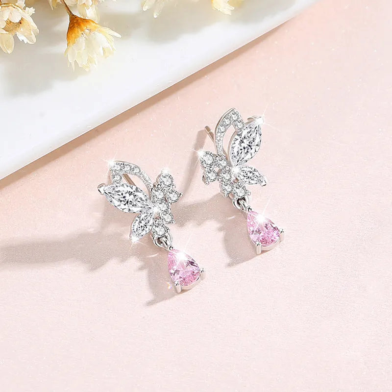Butterfly shaped silver stud earrings with Swarovski crystal details on wings