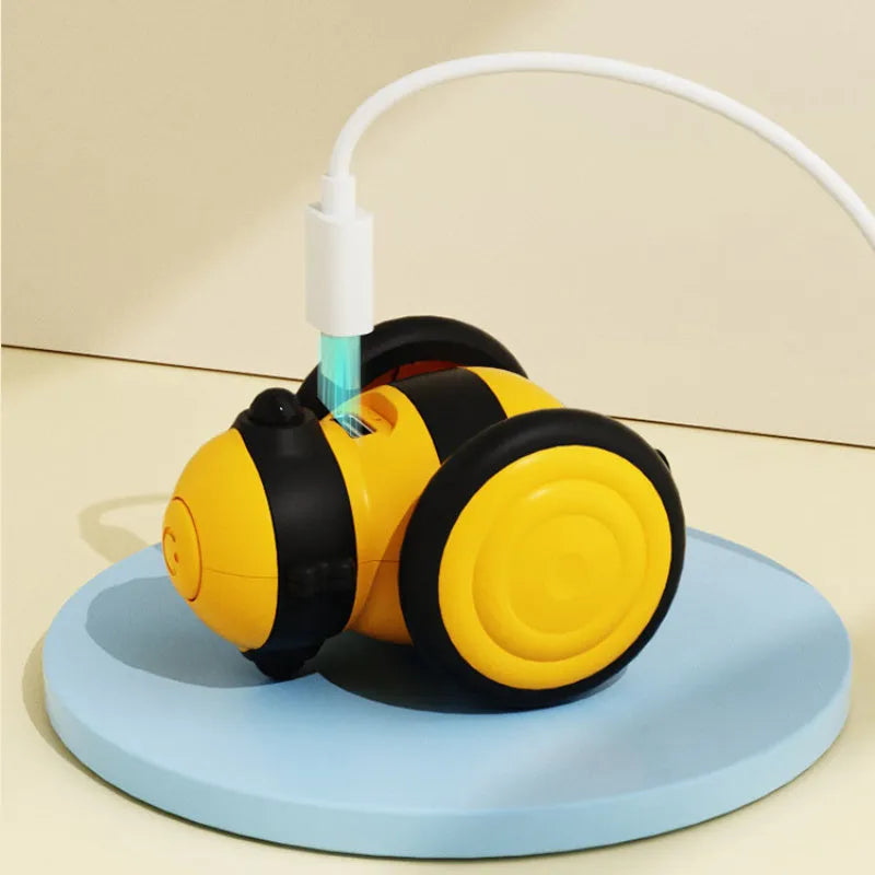 Electric cat toy with bee design and feather teaser in pink or yellow colour options