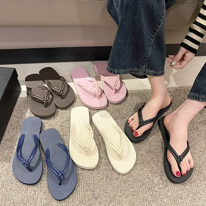 Men's PVC toe-covering flip-flop slippers on a white background, showing the injection moulded sole and available colour options.