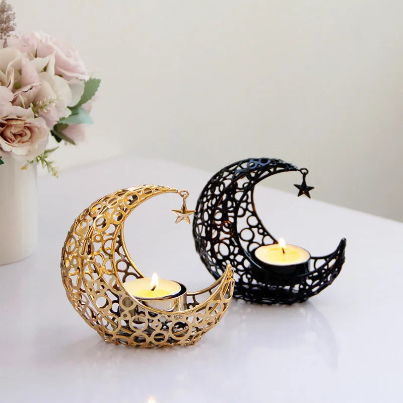 Metal crescent moon candle holder for tealight candles in black or gold colour on desktop