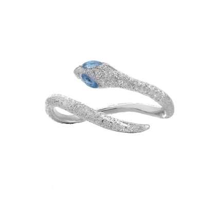 Platinum colour adjustable snake design ring for women on a neutral background.