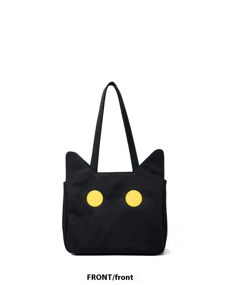 Black cat-shaped nylon tote bag with medium-soft structure, nylon lining, and sandwich zipper pocket, 34cm x 13cm x 27cm.