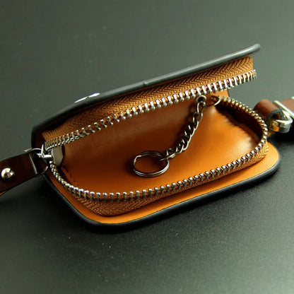 Genuine leather car key case with zipper closure showing black and brown colour options
