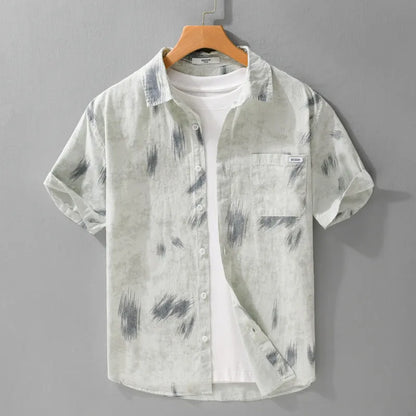 Light green men's loose-fit floral print short-sleeve cotton cardigan laid flat.