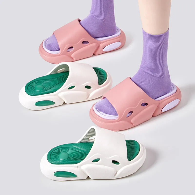 Pair of two-tone thick-soled EVA slippers with a leather lining, shown in pink and purple.