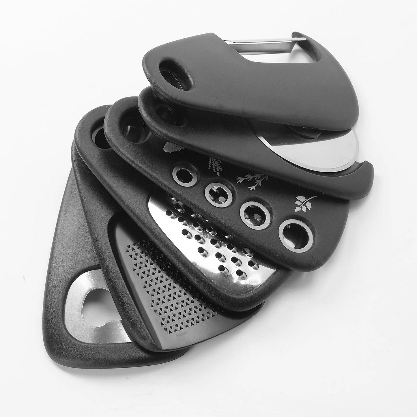 Six stackable kitchen widgets and a cleaning brush in a colour box, showing modern design