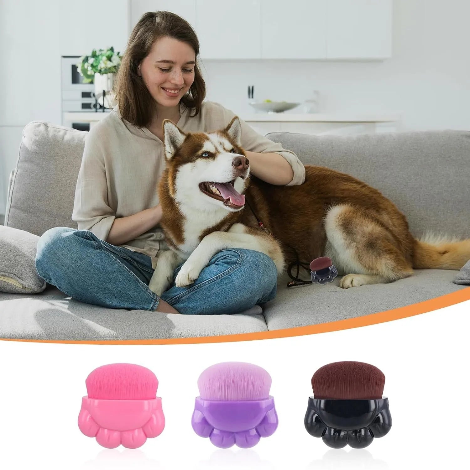 Three small paw-shaped pet balm brushes with soft heads inside clear plastic storage cases.